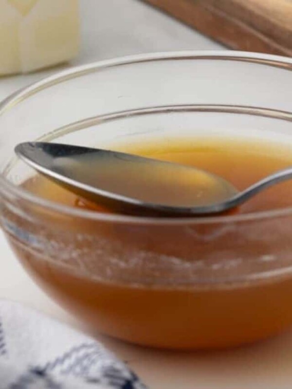 close up of a bowl of browned butter with a spoon