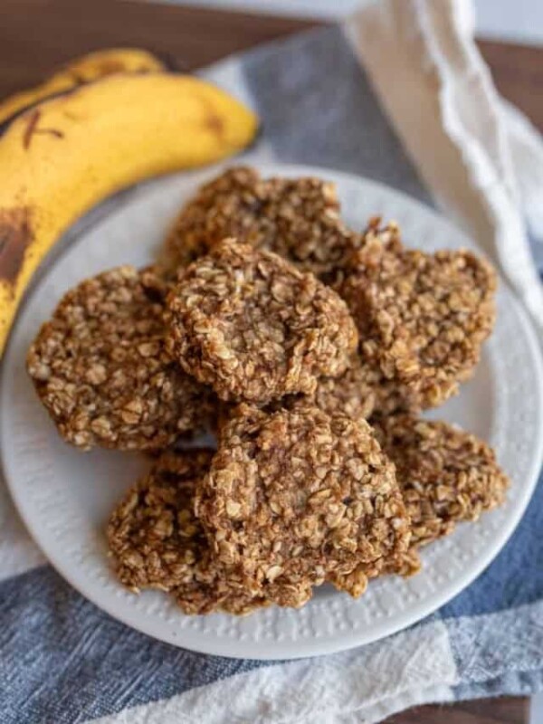 banana oatmeal cookies stacked on a white plate