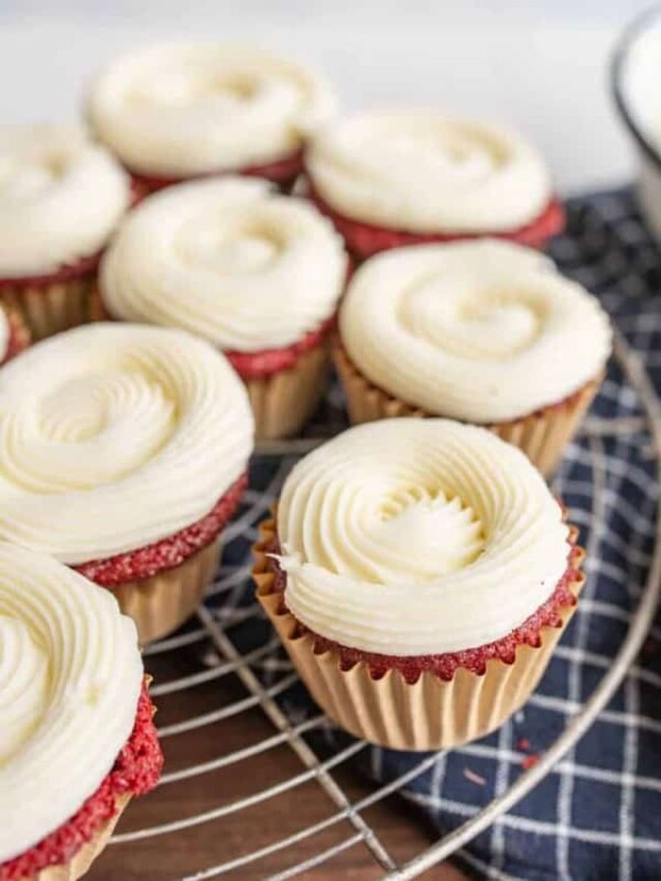 red velvet cupcakes with piped iced cream cheese frosting