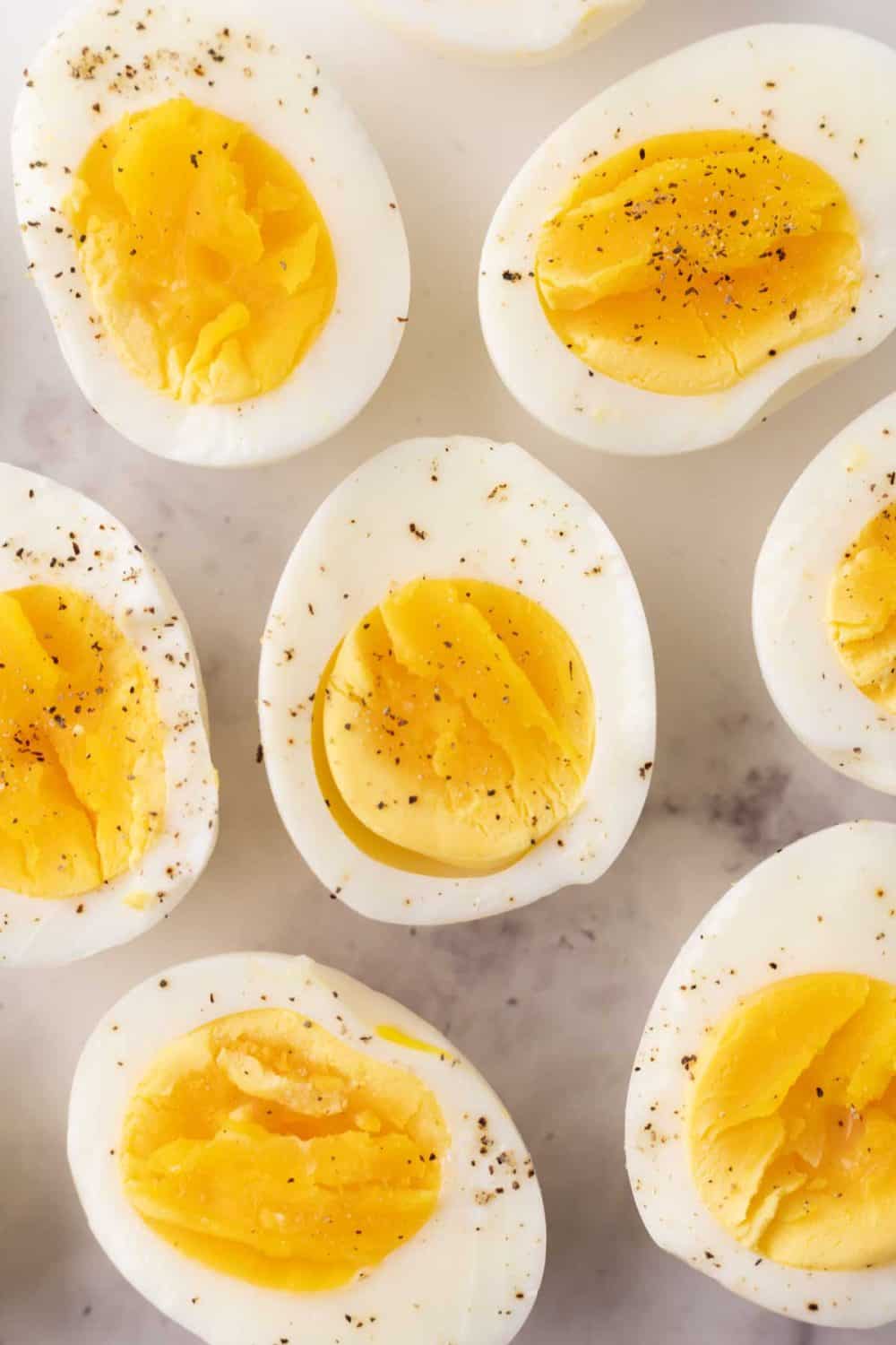 halved seasoned air fryer cooked eggs with sale and pepper.