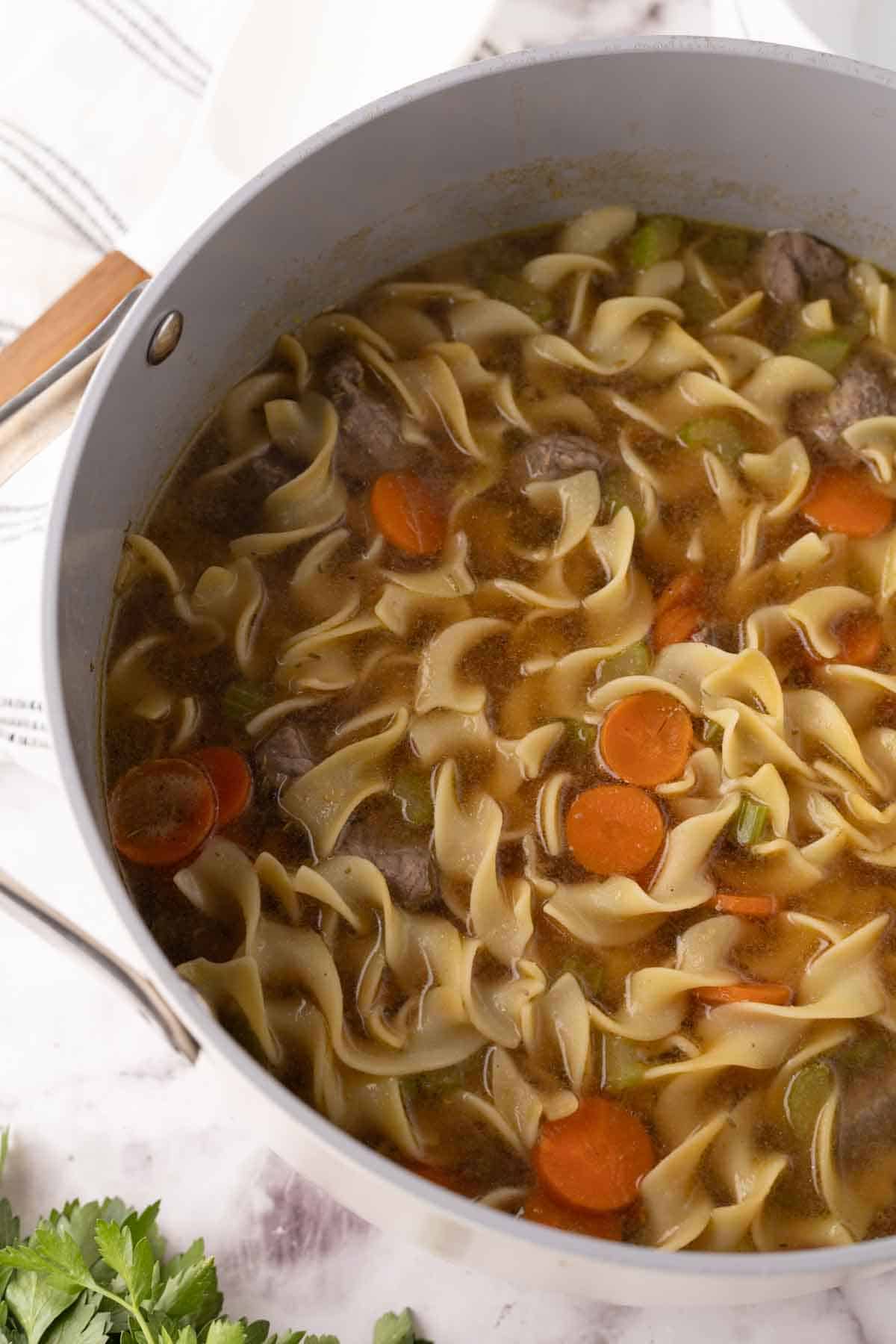 beef noodle soup recipe in a large pot.