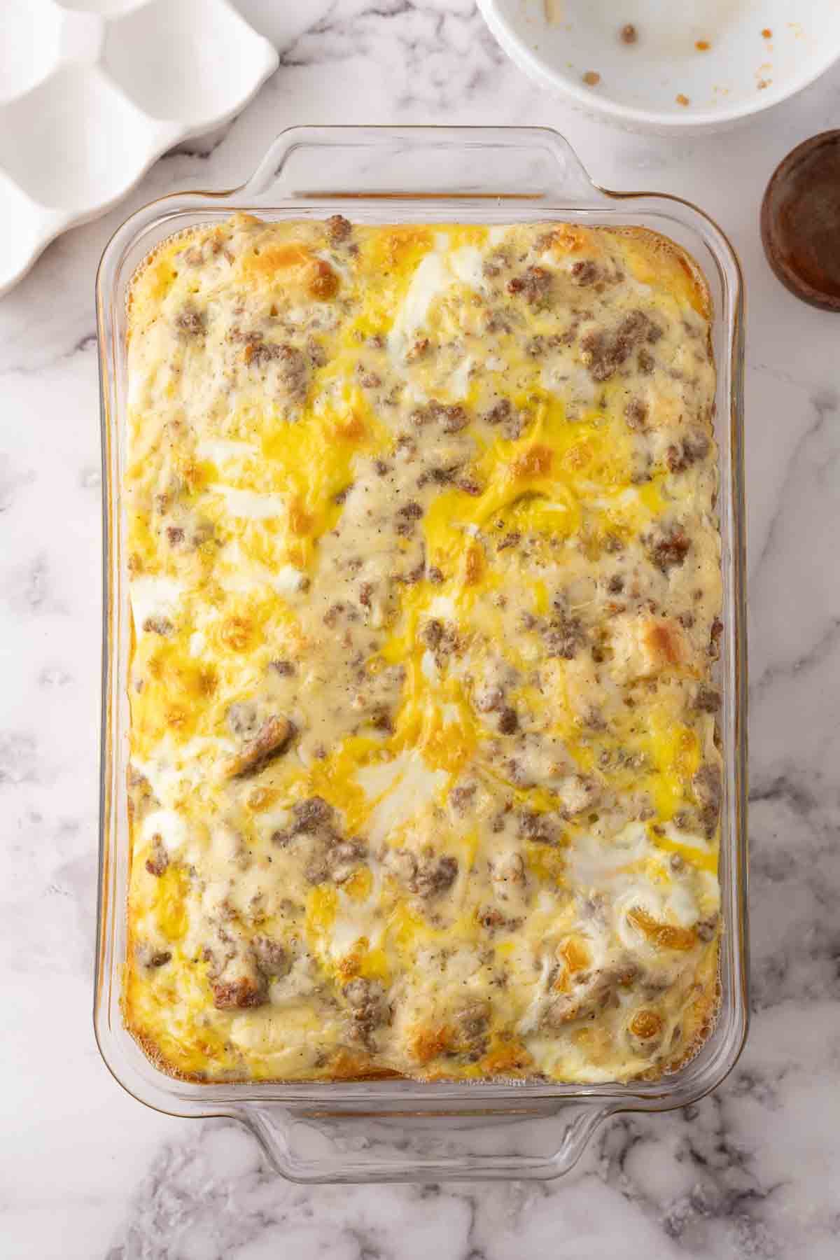 biscuits and gravy casserole recipe in a 9x12 dish.