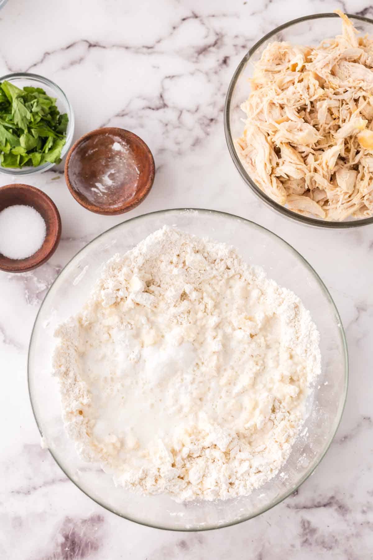 mixing bowl of ingredients with bisquick dumplings recipe in progress.