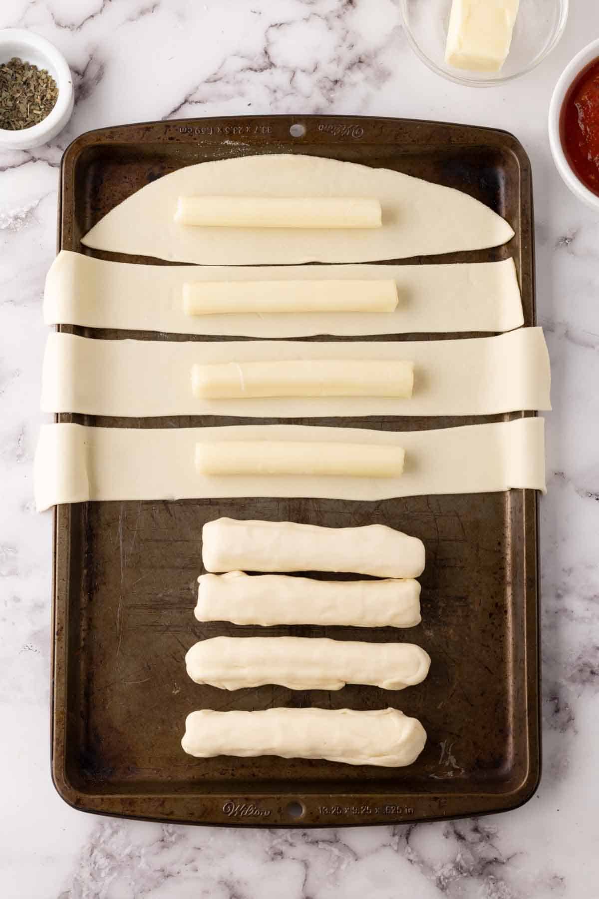 bosco sticks recipe in progress on a sheet pan.