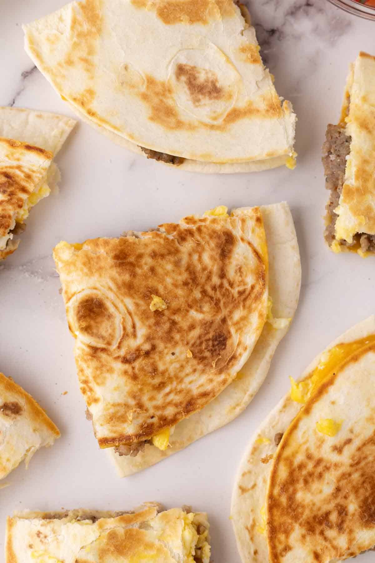tray of triangle slices of breakfast quesadillas.