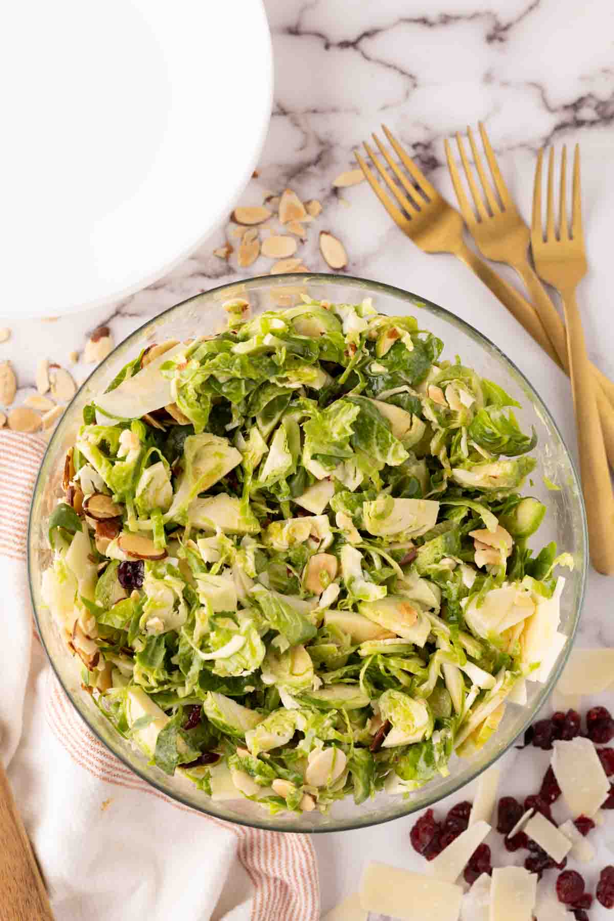 Clear mixing bowl with Brussels sprouts salad.