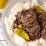 tender Mississippi shredded pot roast with pickled banana peppers over rice.