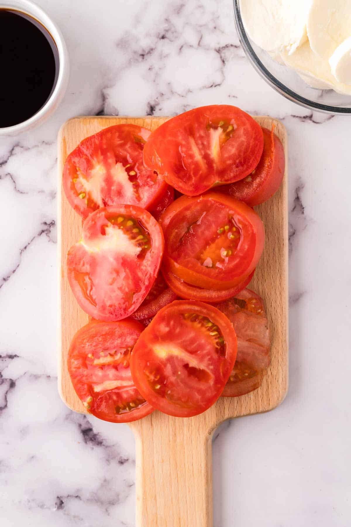 fresh tomatoes cut for the caprese salad recipe.