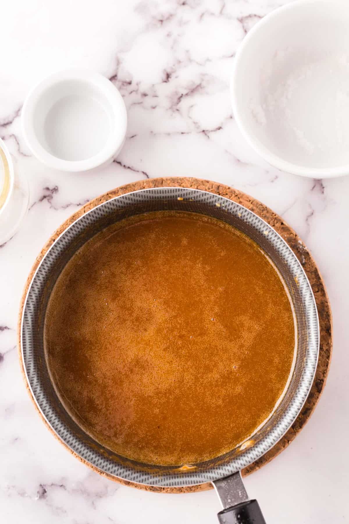 sauce pan with ingredients to make homemade caramel sauce.