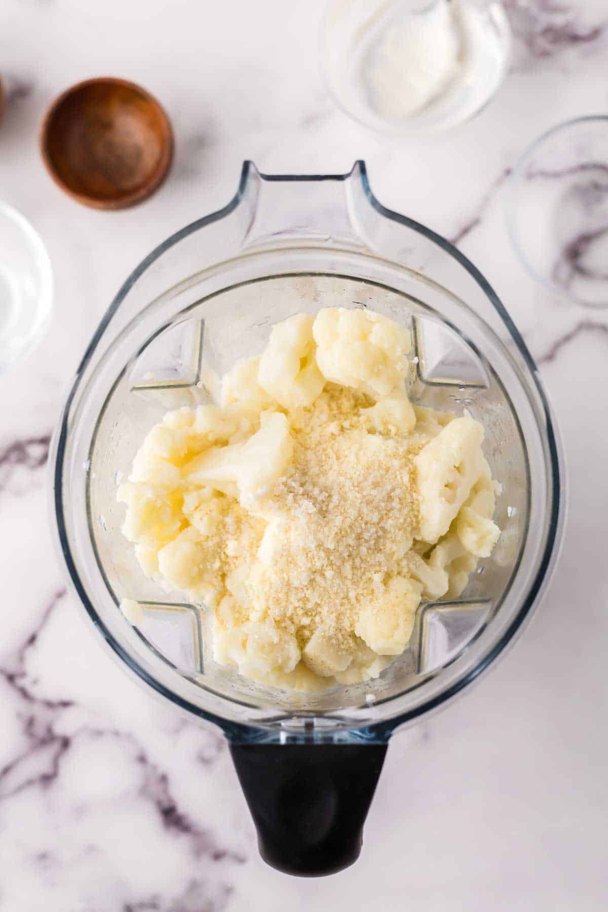 blender with the process making cauliflower mashed potatoes recipe.