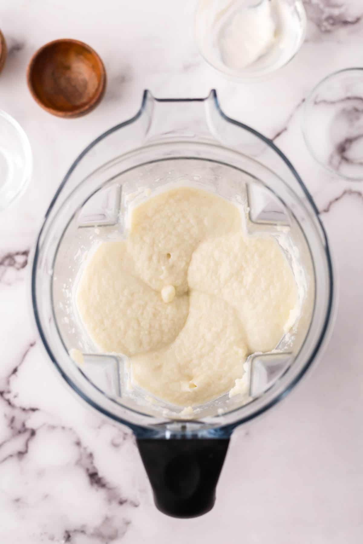 blender with the process making cauliflower mashed potatoes recipe.