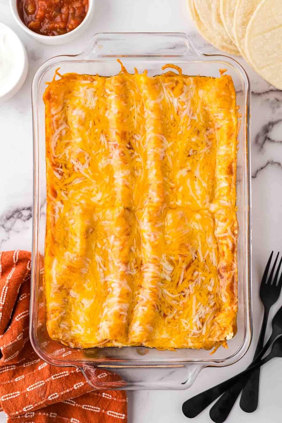 a cooked pan of cheese enchiladas.