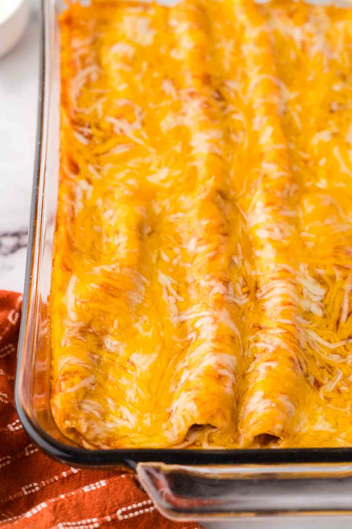 a cooked pan of cheese enchiladas.