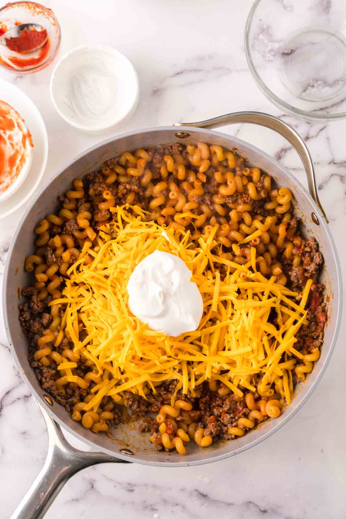 sauce pan with the progress of cheeseburger casserole recipe.