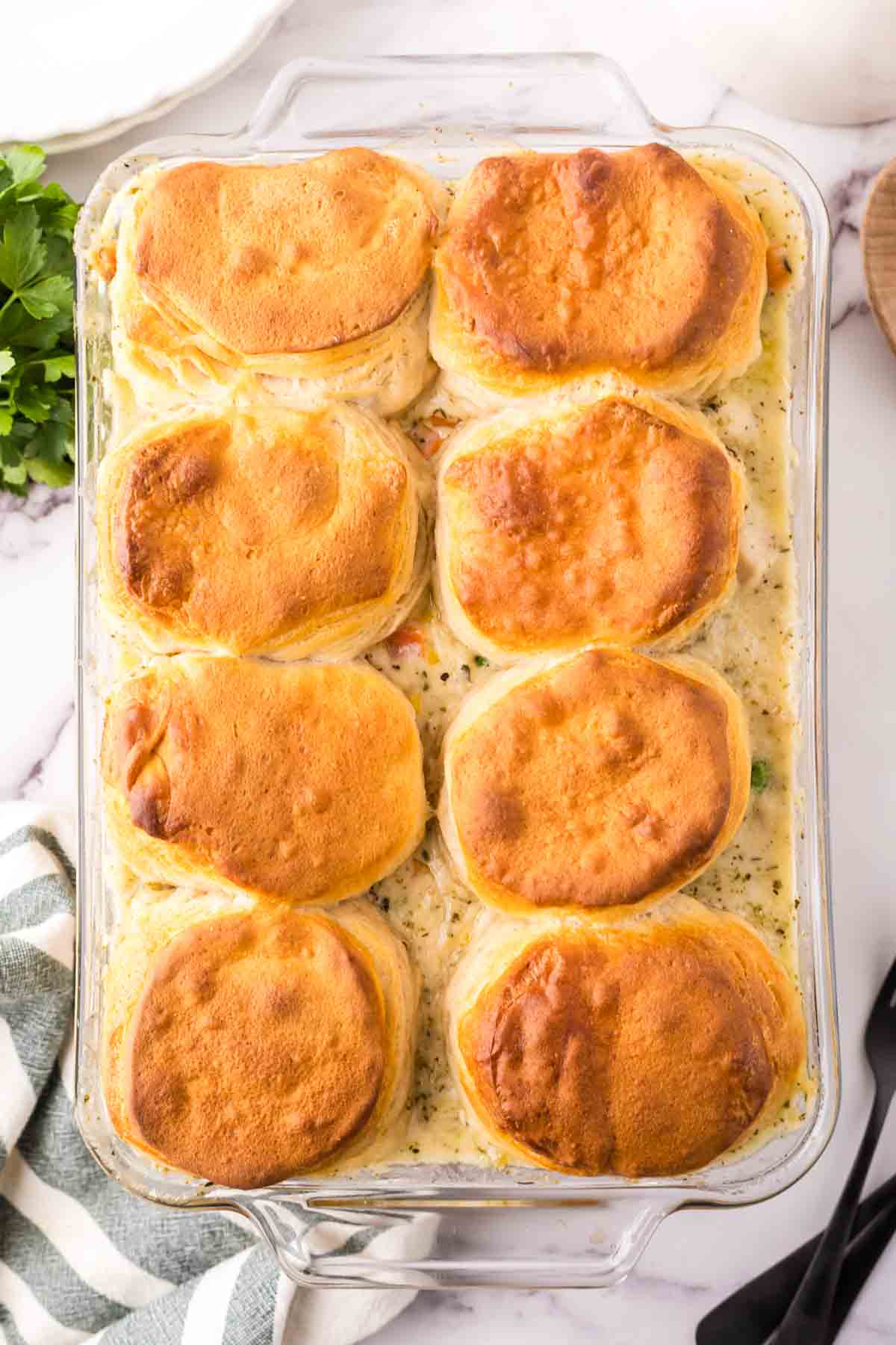 chicken and biscuits recipe baked into a casserole dish.