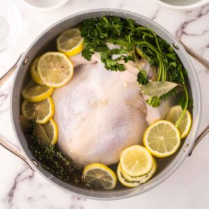 large stock pot with ingredients to start a chicken brine recipe.