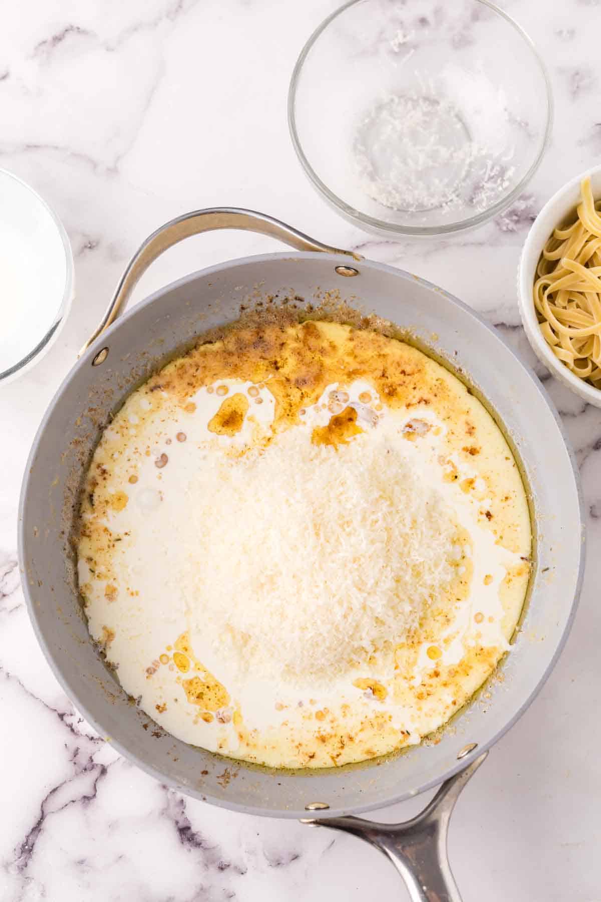 sauce pan with ingredients to make the chicken fettuccine alfredo recipe.