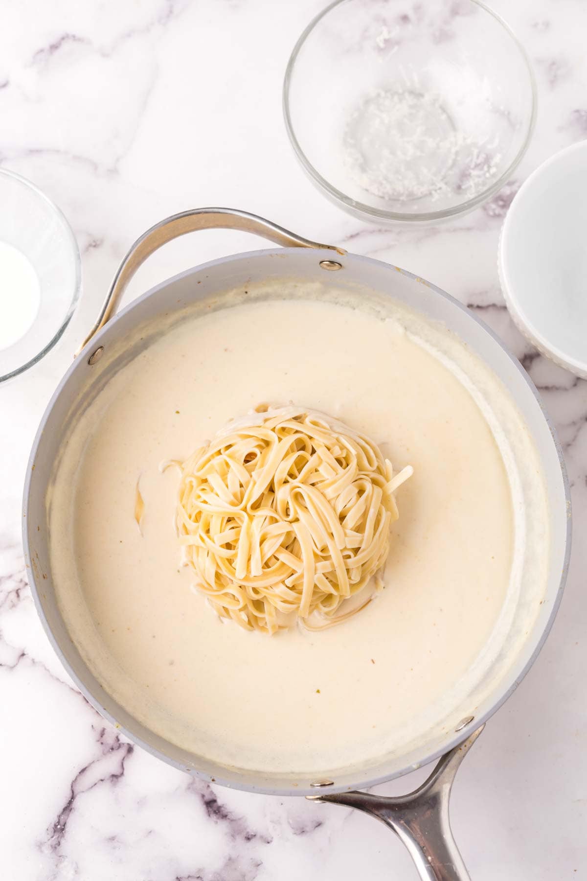 sauce pan with ingredients to make the chicken fettuccine alfredo recipe.