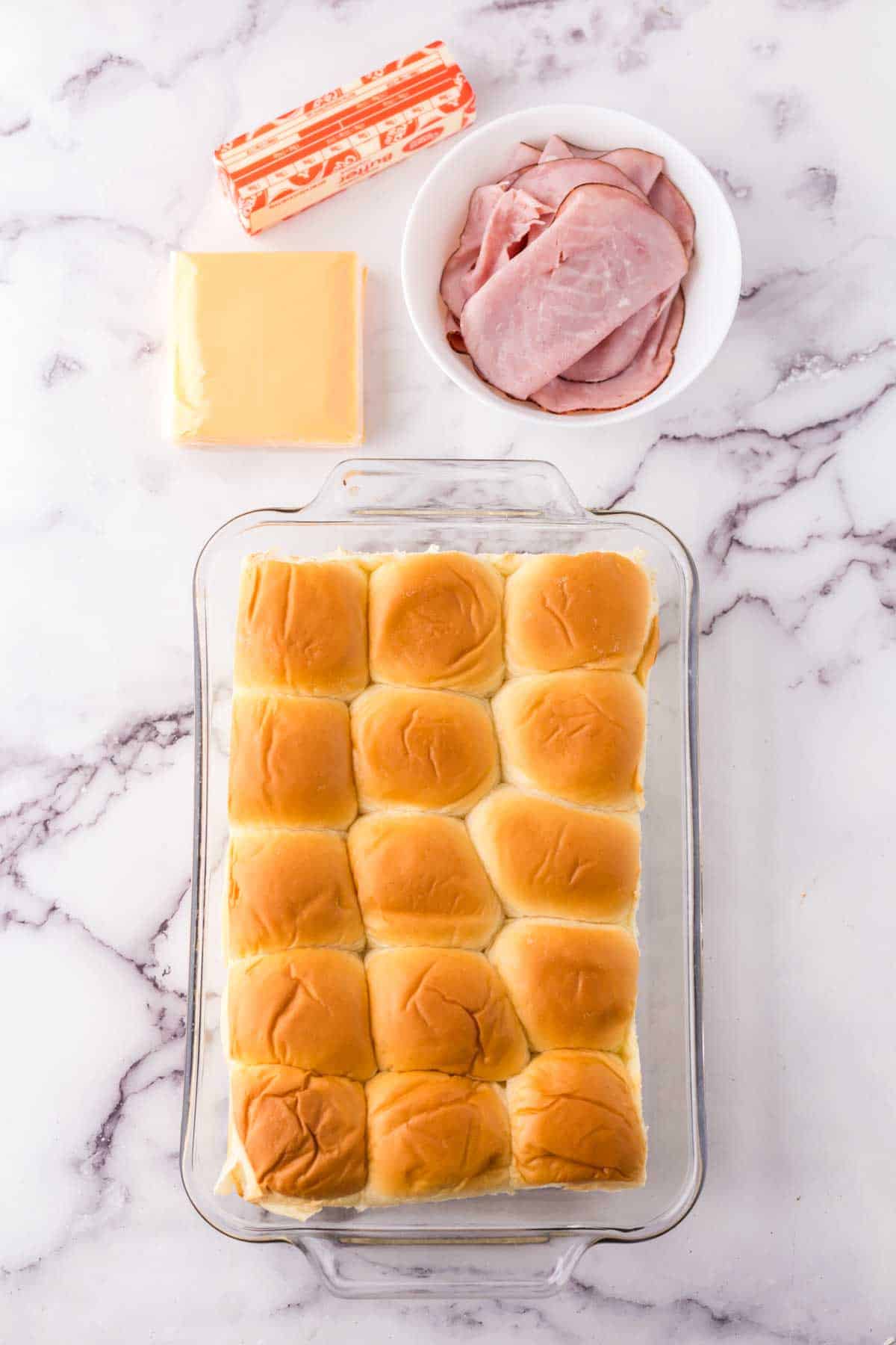 portion bowls each with raw ingredients to make Hawaiian roll sliders.