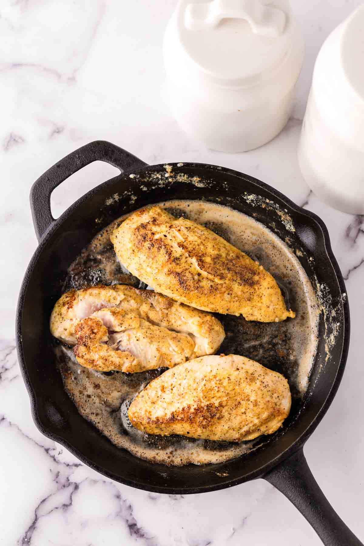 baked chicken breast in a cast iron skillet.