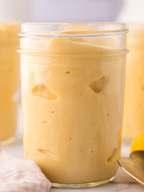 Mango lassi in glass mason jars.