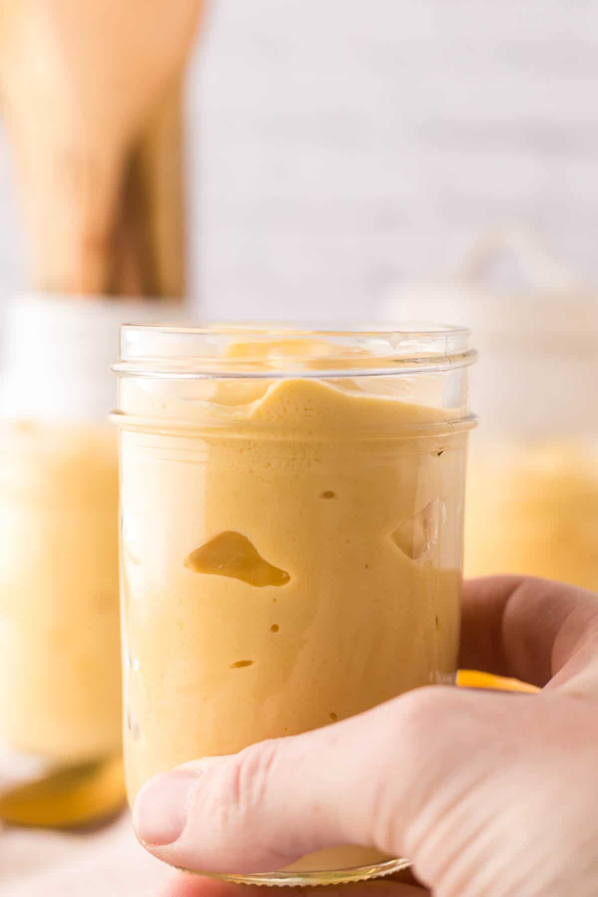 Mango lassi in glass mason jars.