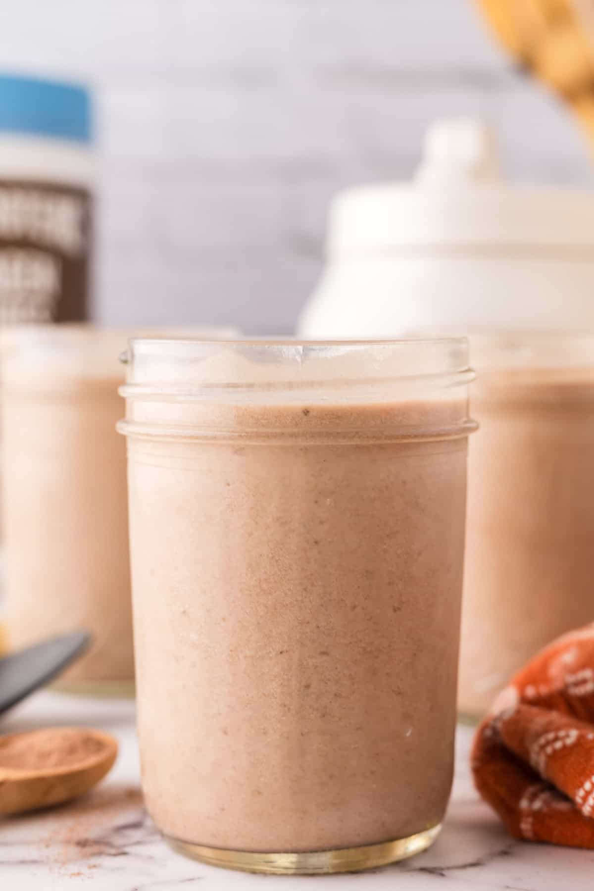 glass mason jars with protein shakes inside.