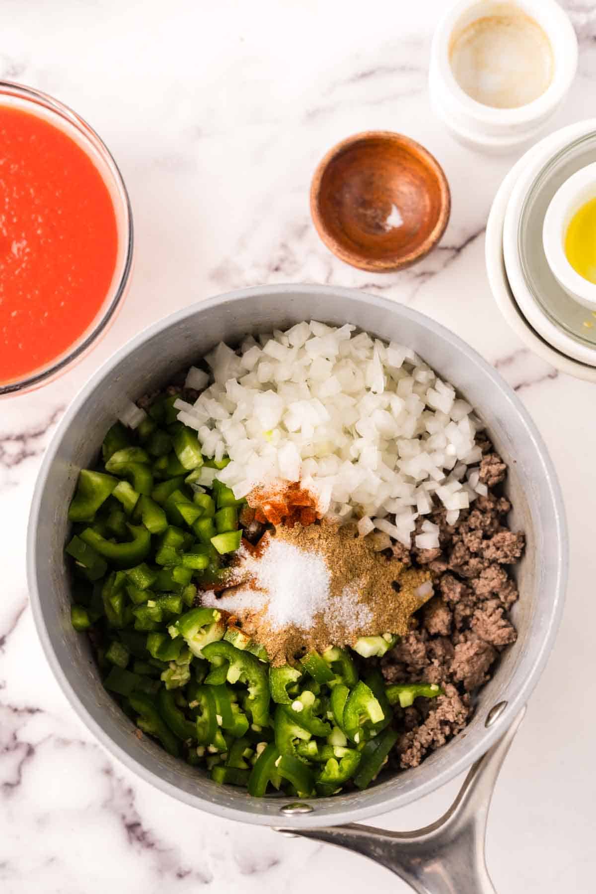 soup pan with the process of making Texas chili.