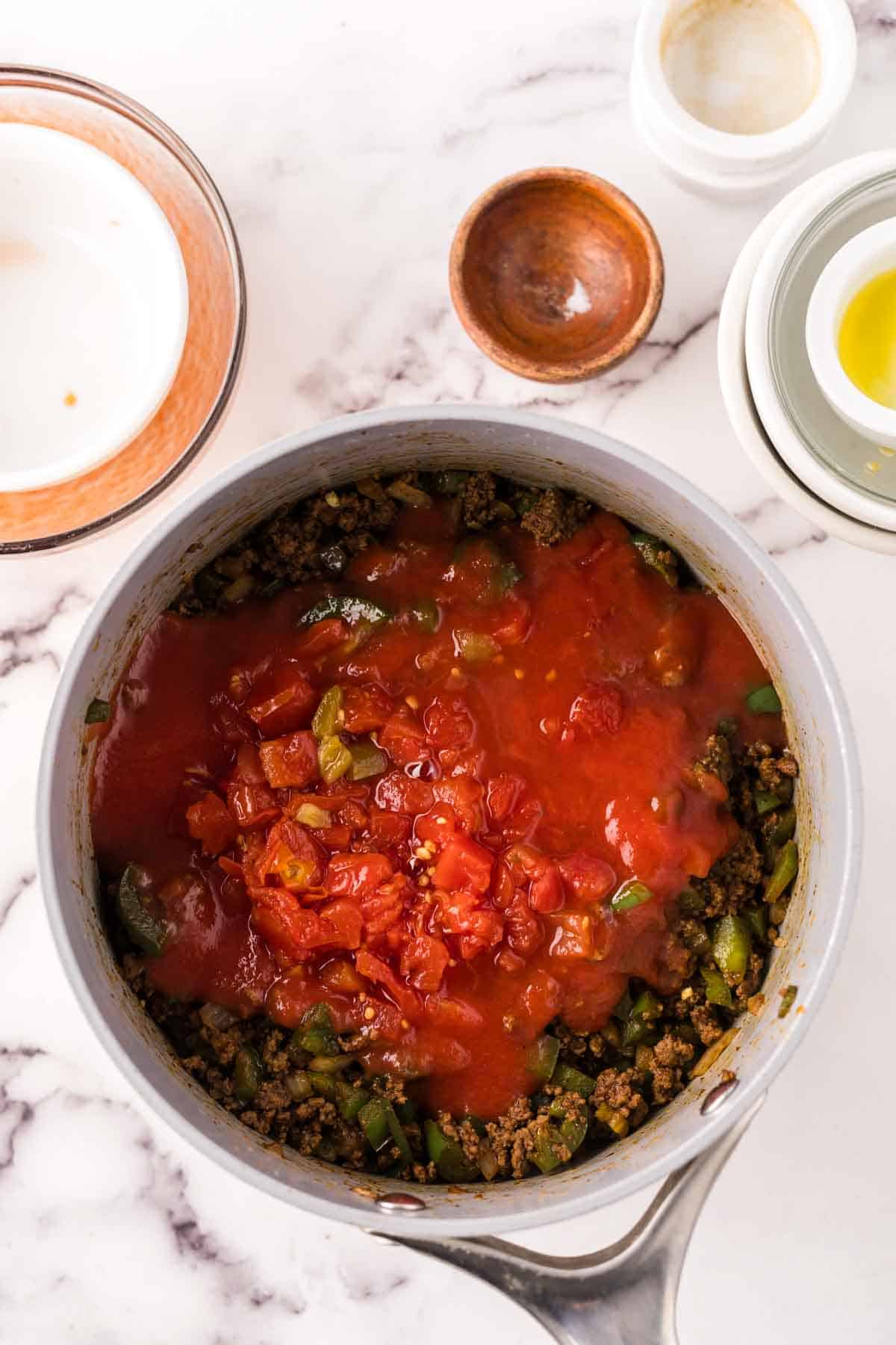 soup pan with the process of making Texas chili.