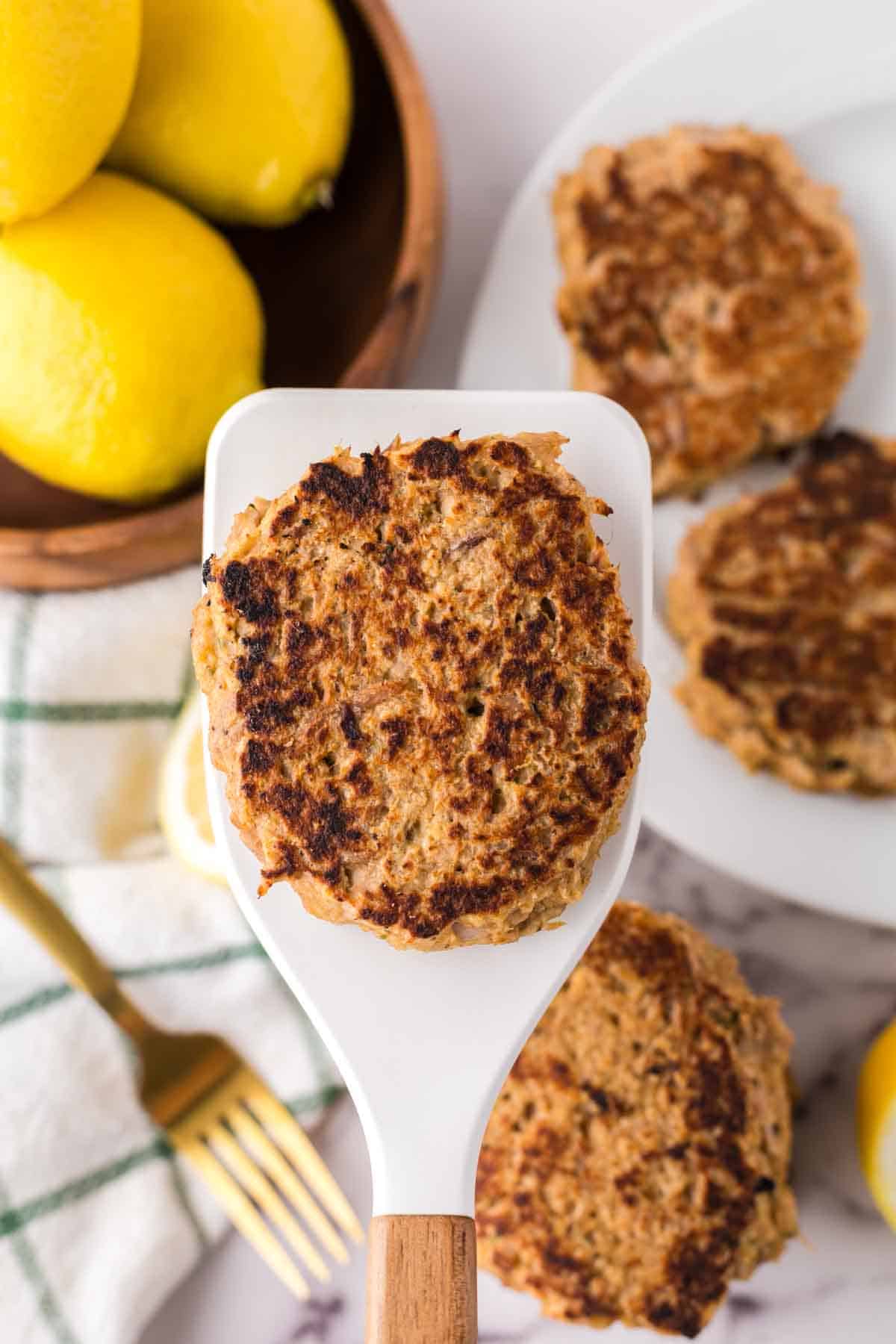 tuna patty on a spatula ready to serve.