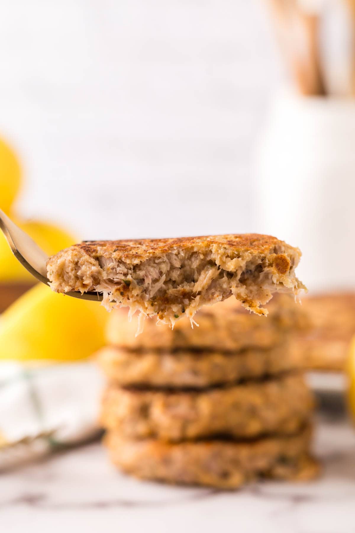 forkful of a bite of a freshly made tuna patty.