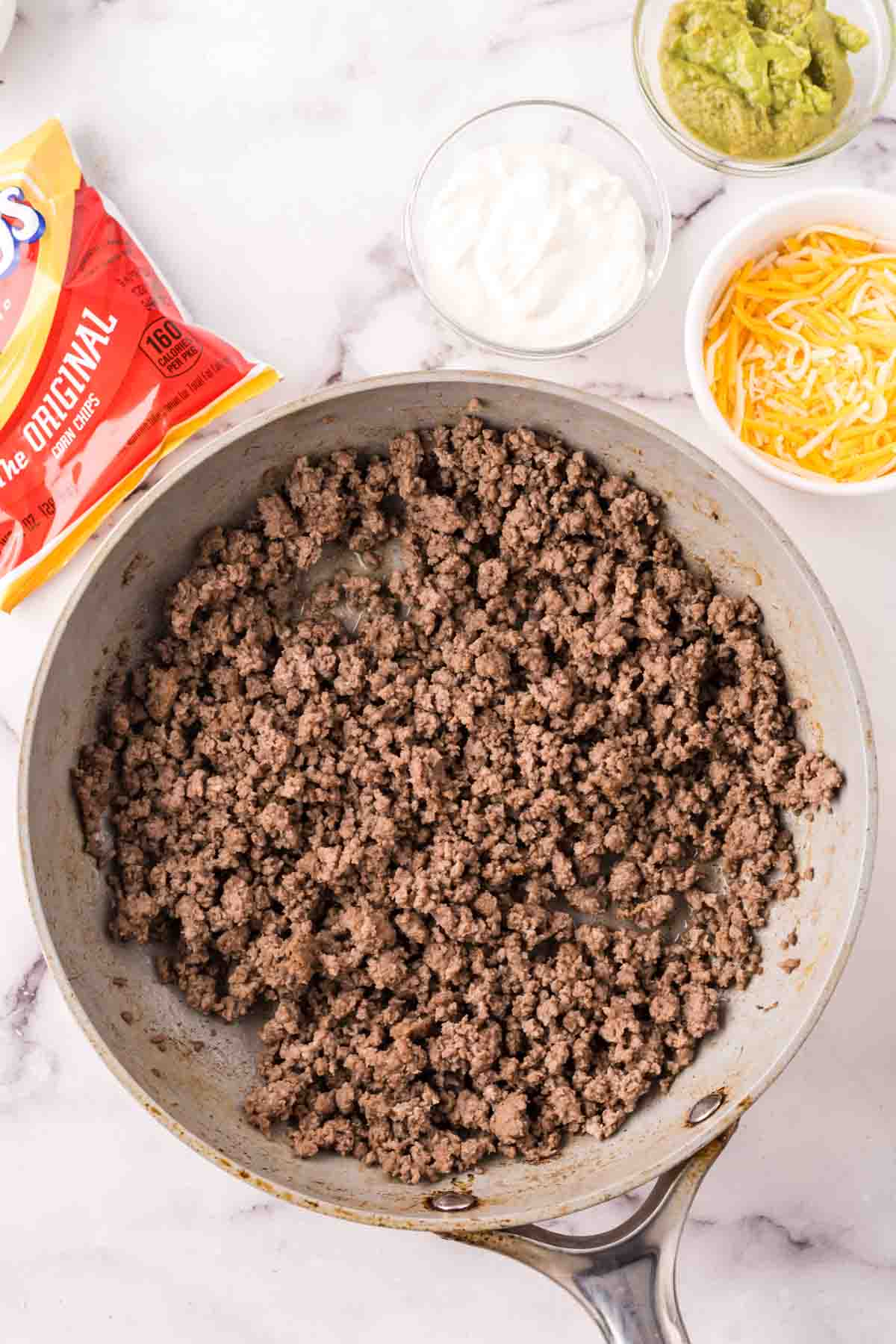 ground beef in a bowl for the walking taco recipe.