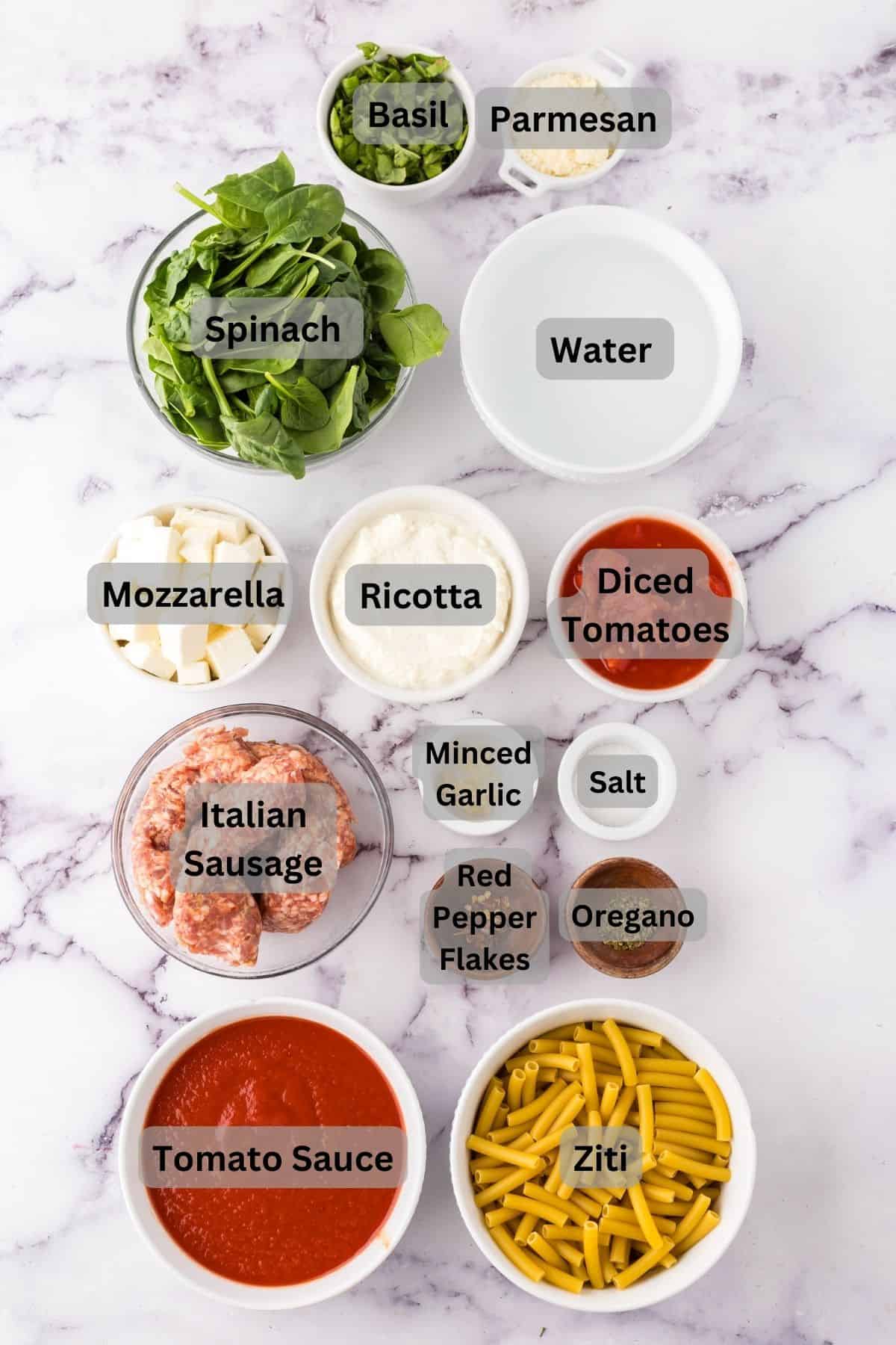 portion bowls each with digitally labeled raw ingredients to make one pot baked Ziti.