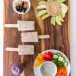 stony field after school snacks on a wooden board.