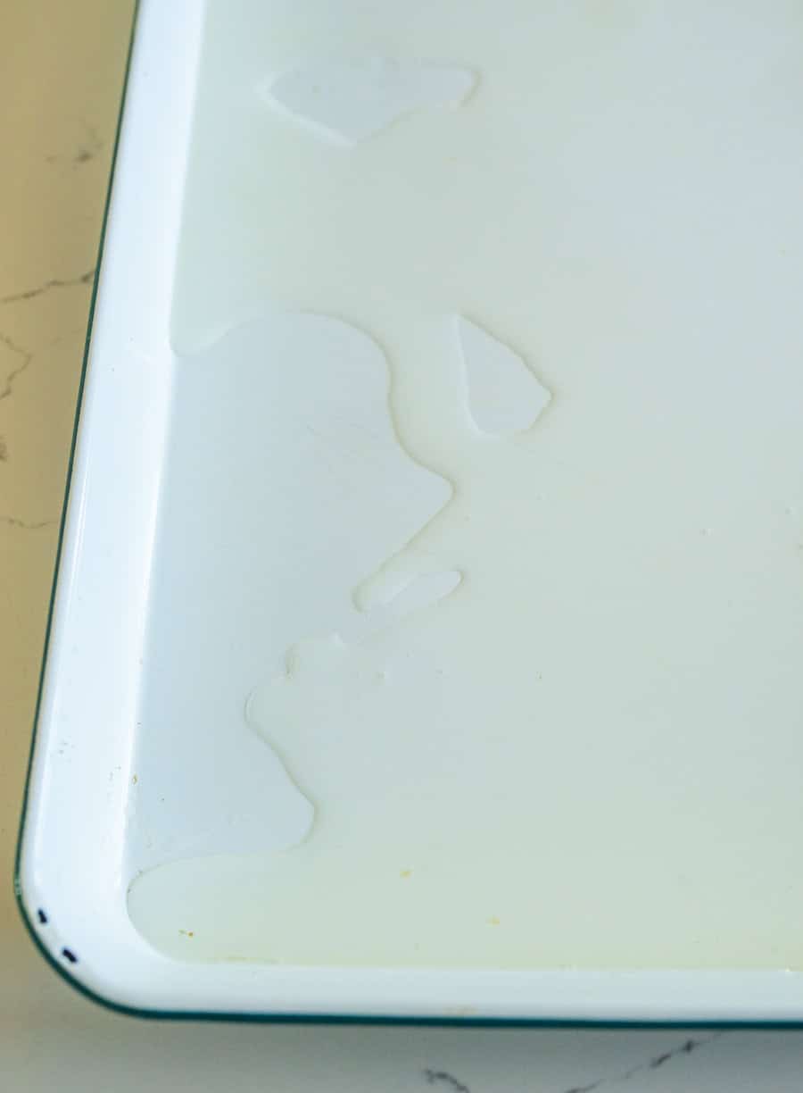 Oil on a white enamel sheet pan.