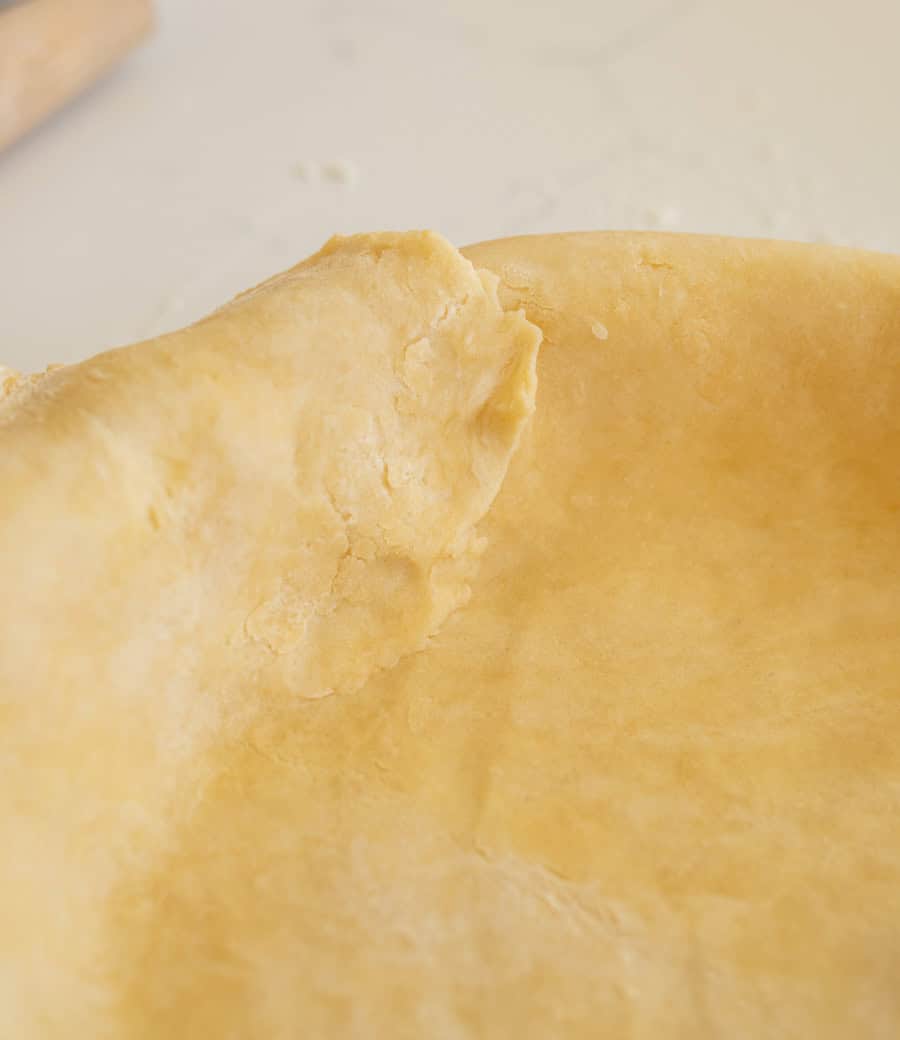 Close-up of the edge of the pie crust ensuring that there are no gaps. 