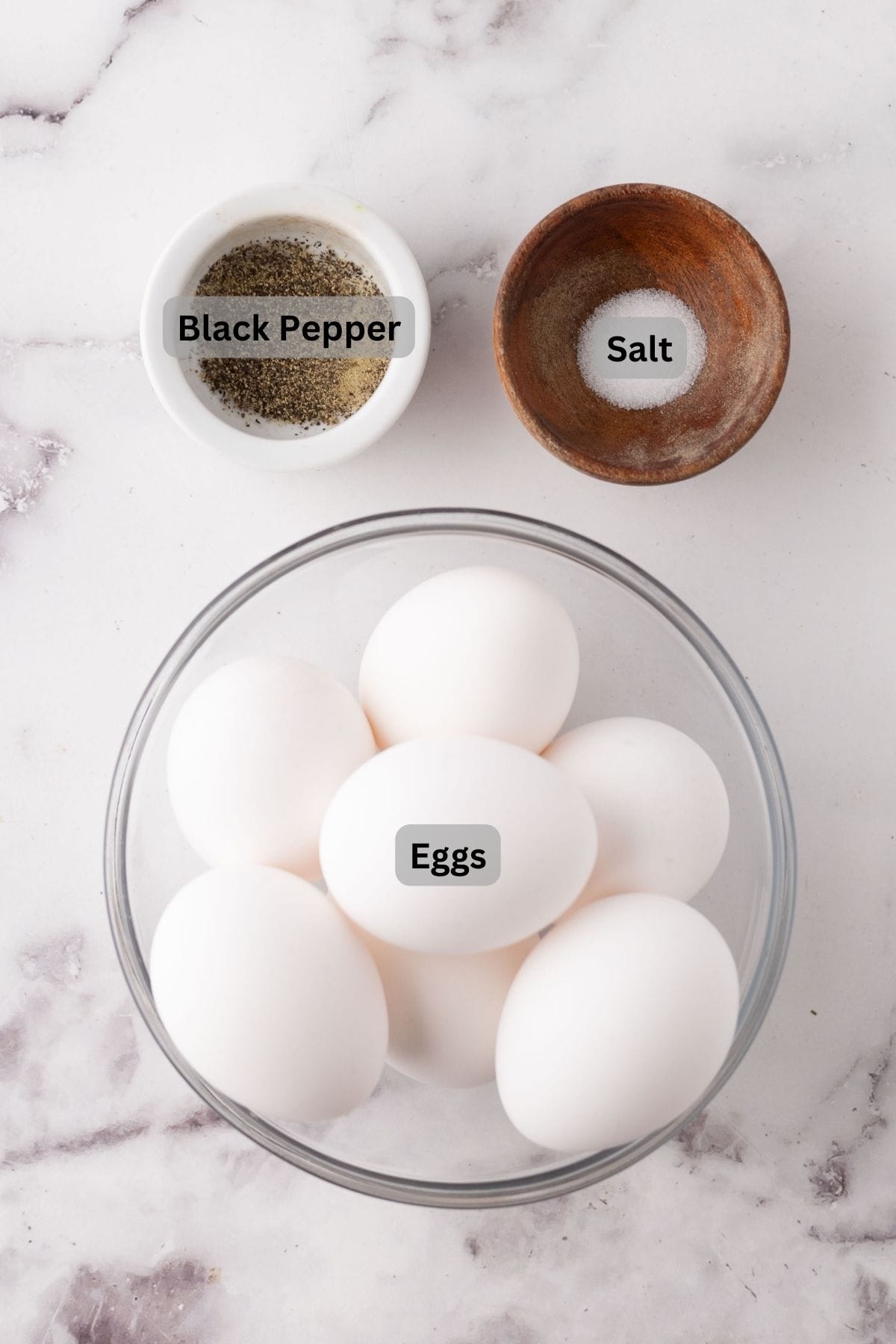 portion bowls each with digitally labeled raw ingredients to make an air fryer egg.