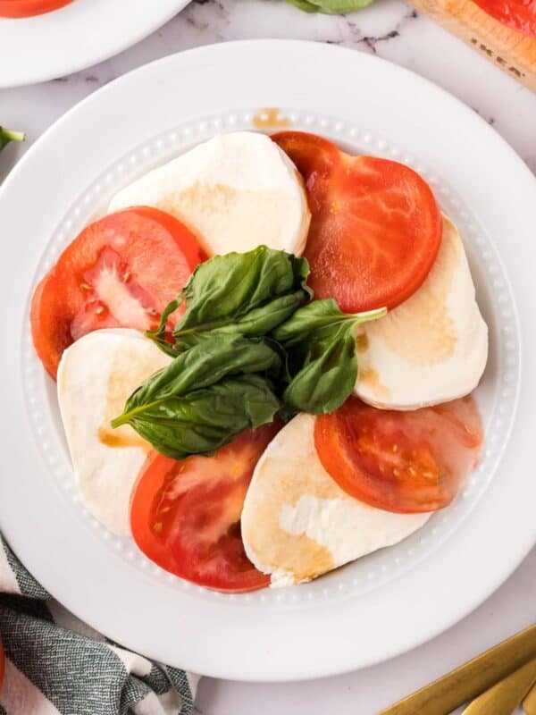 Caprese Salad on a round plate.