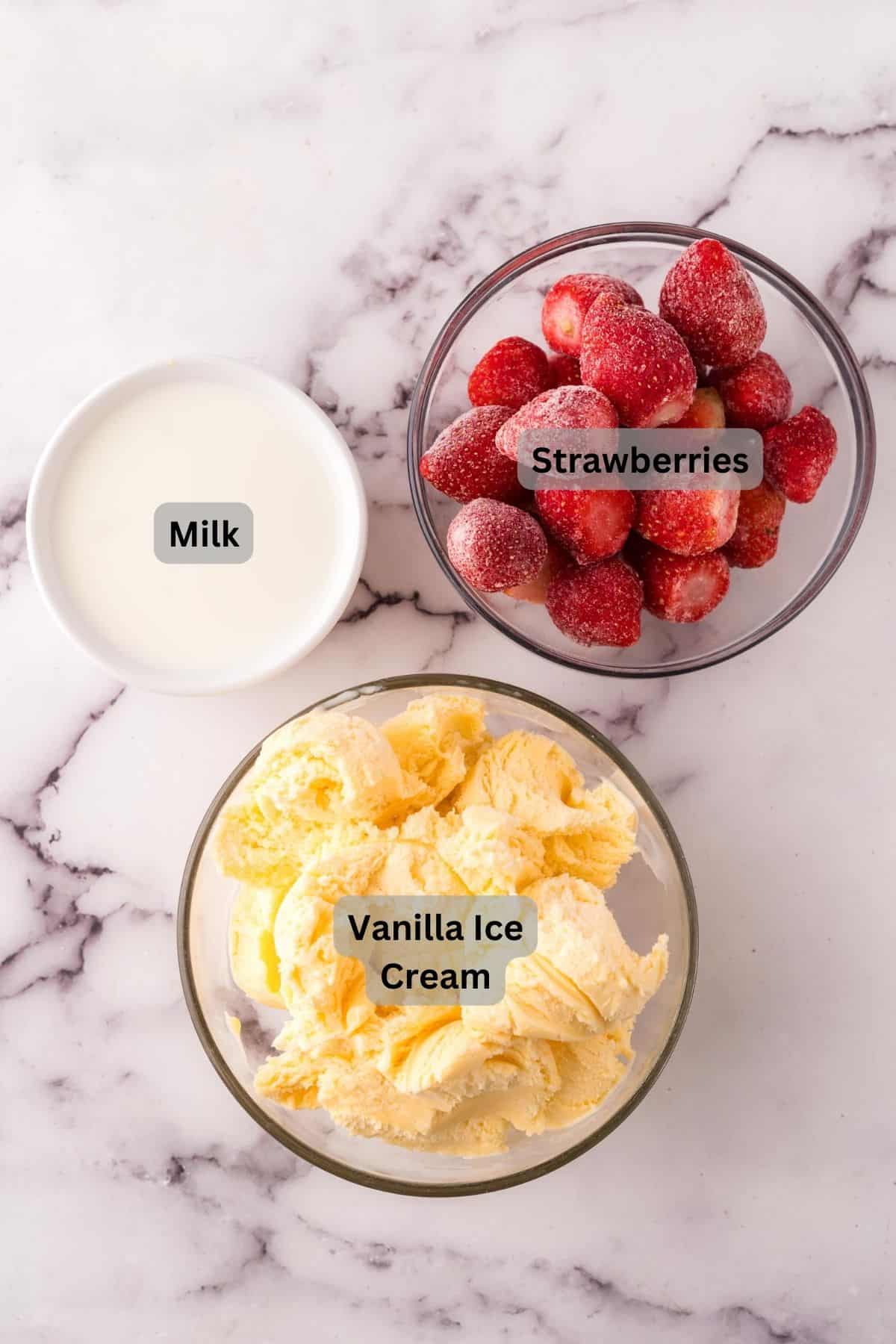 portion bowls each with raw ingredients to make strawberry milkshake.