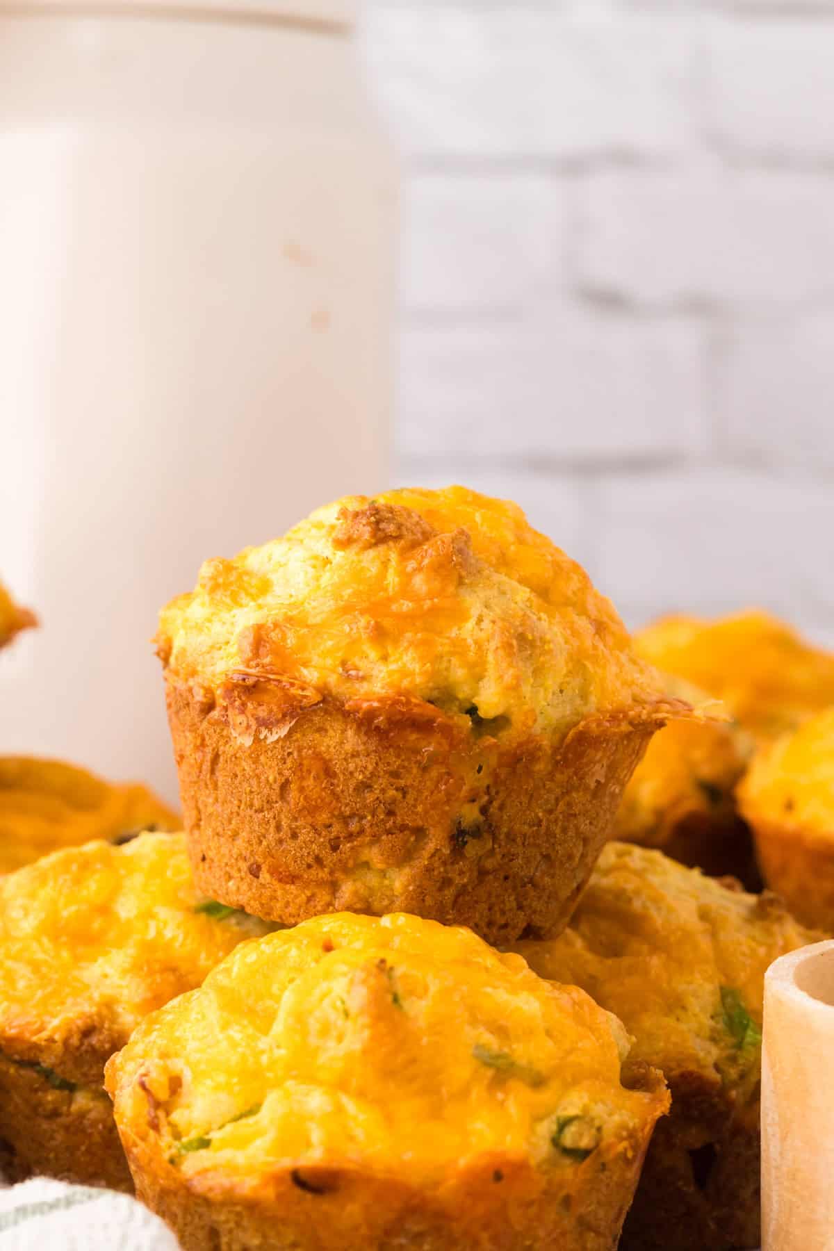 baked cheddar bacon cornbread muffins on the counter.