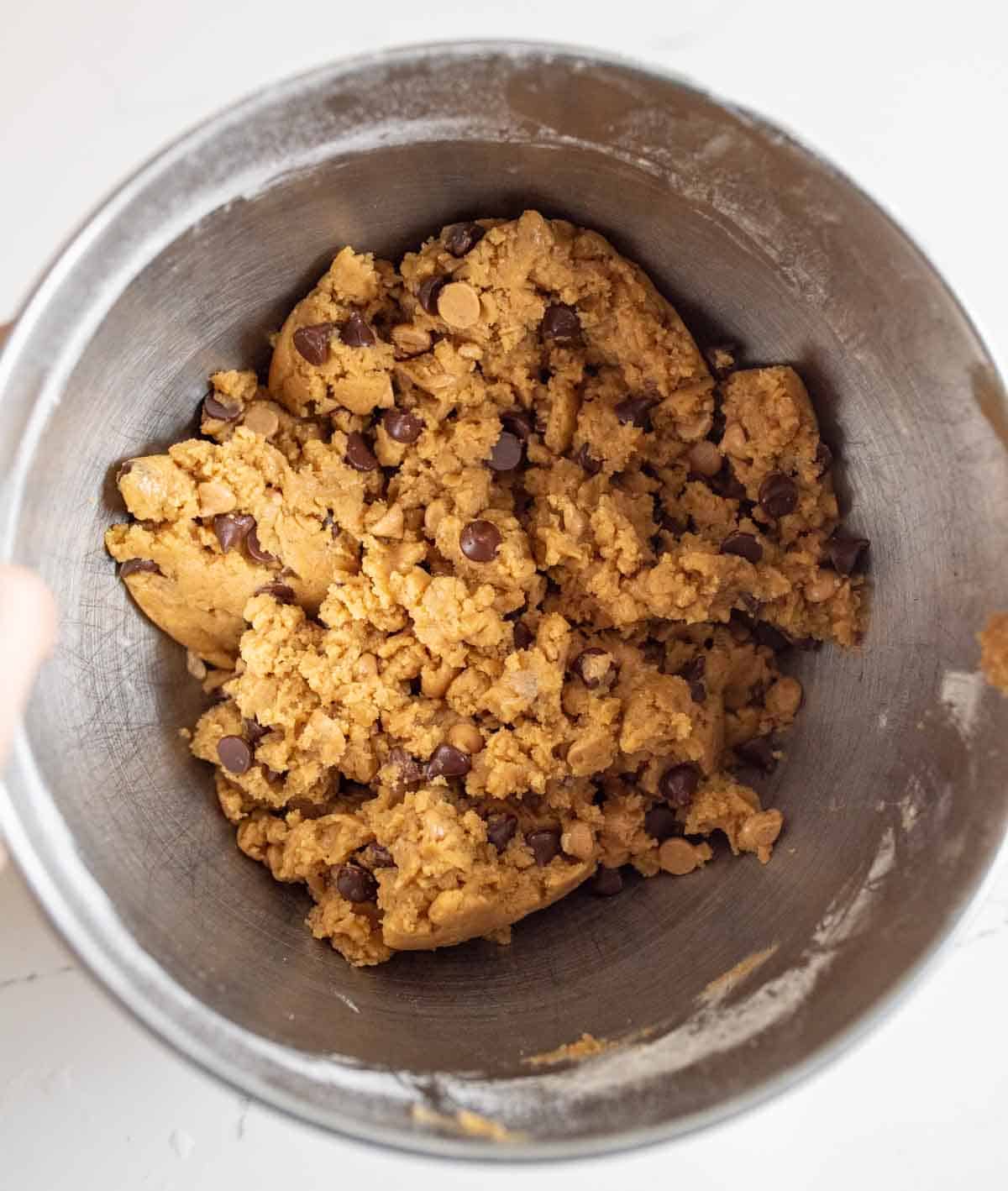 chocolate chip cookies with peanut butter chips dough in the mixing bowl.