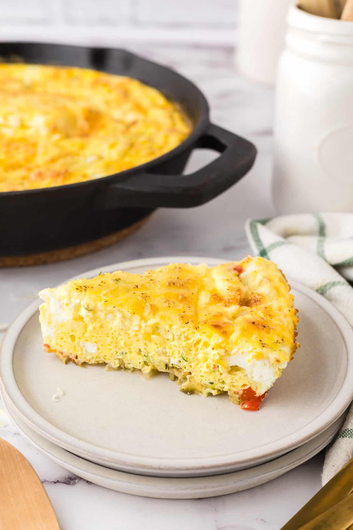 Farmhouse egg bake recipe in triangle pie slices on round plate.