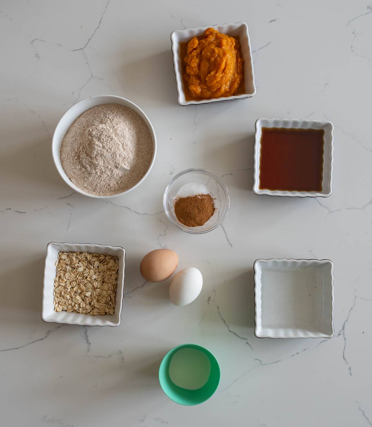 healthy pumpkin muffins in portioned ingredients.