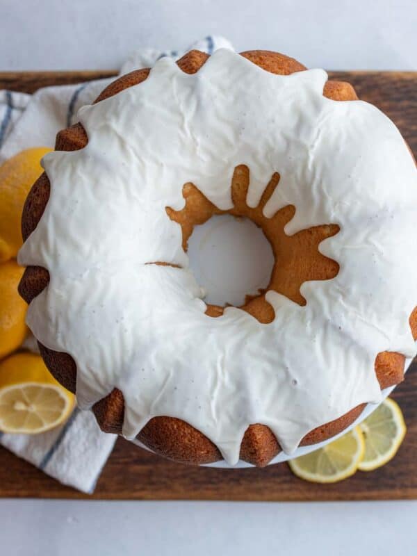 whole round lemon bundt cake with white icing.