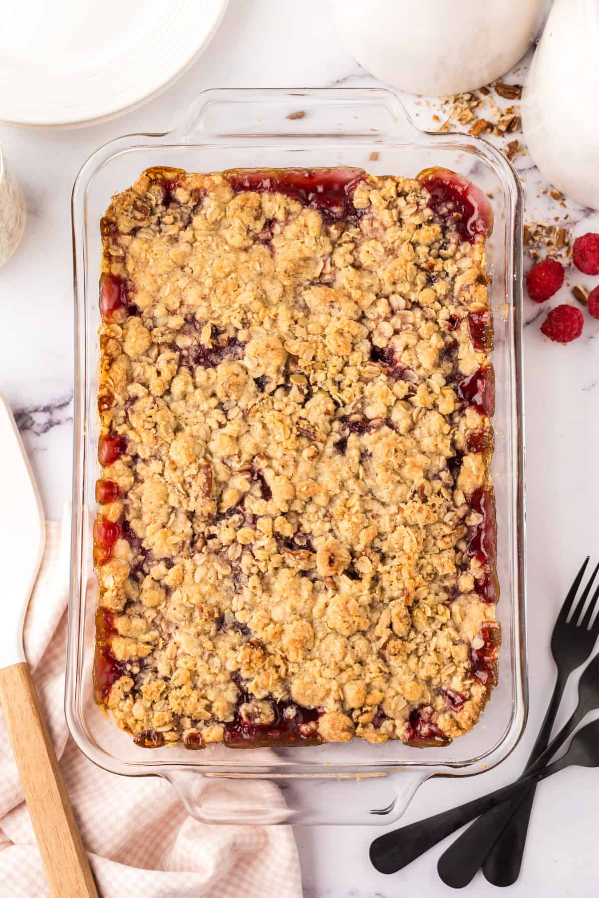 clear glass dish with raspberry streusel bars.