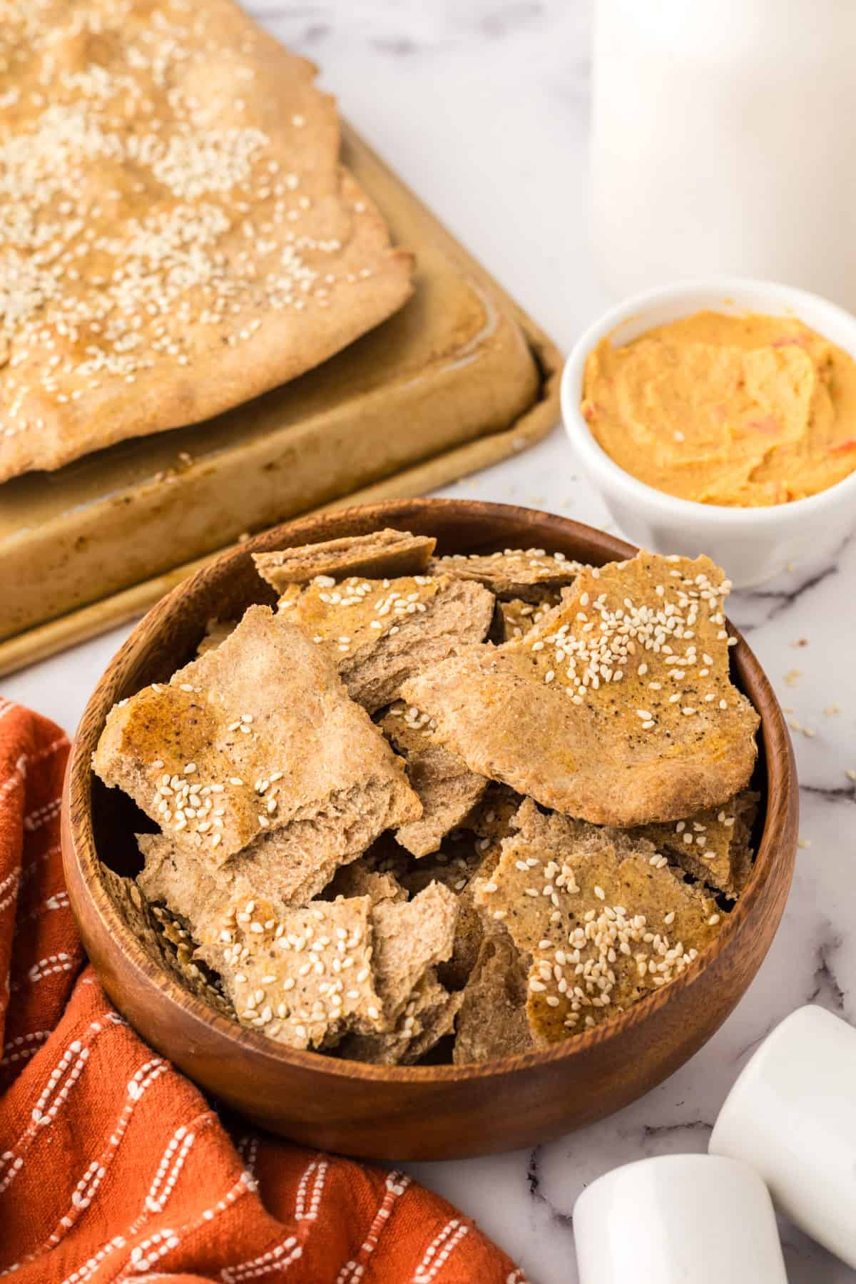 simple lavish bread crackers in a wooden bowl.