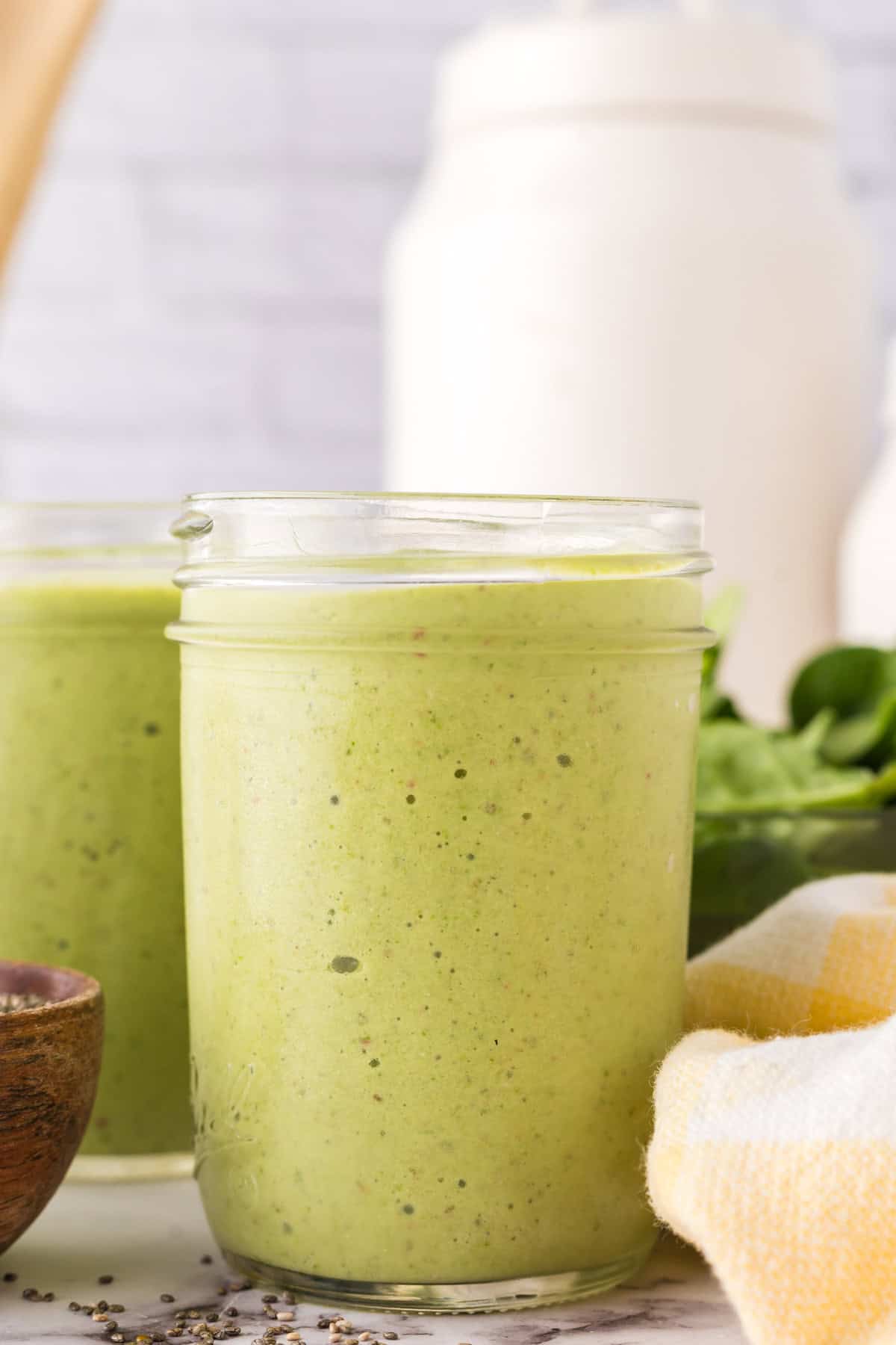 Glass filled with a green smoothie.