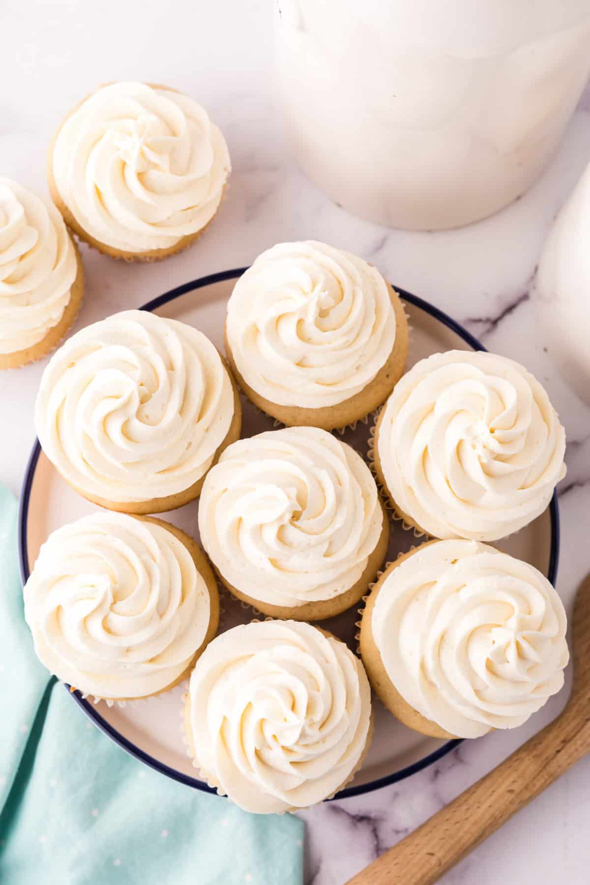 a round plate of copycat vanilla cupcakes.