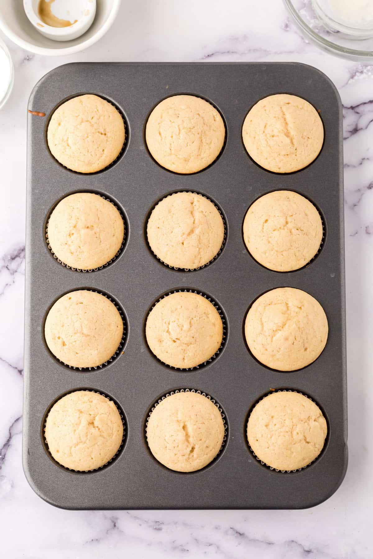 vanilla cupcakes baked into the tin.