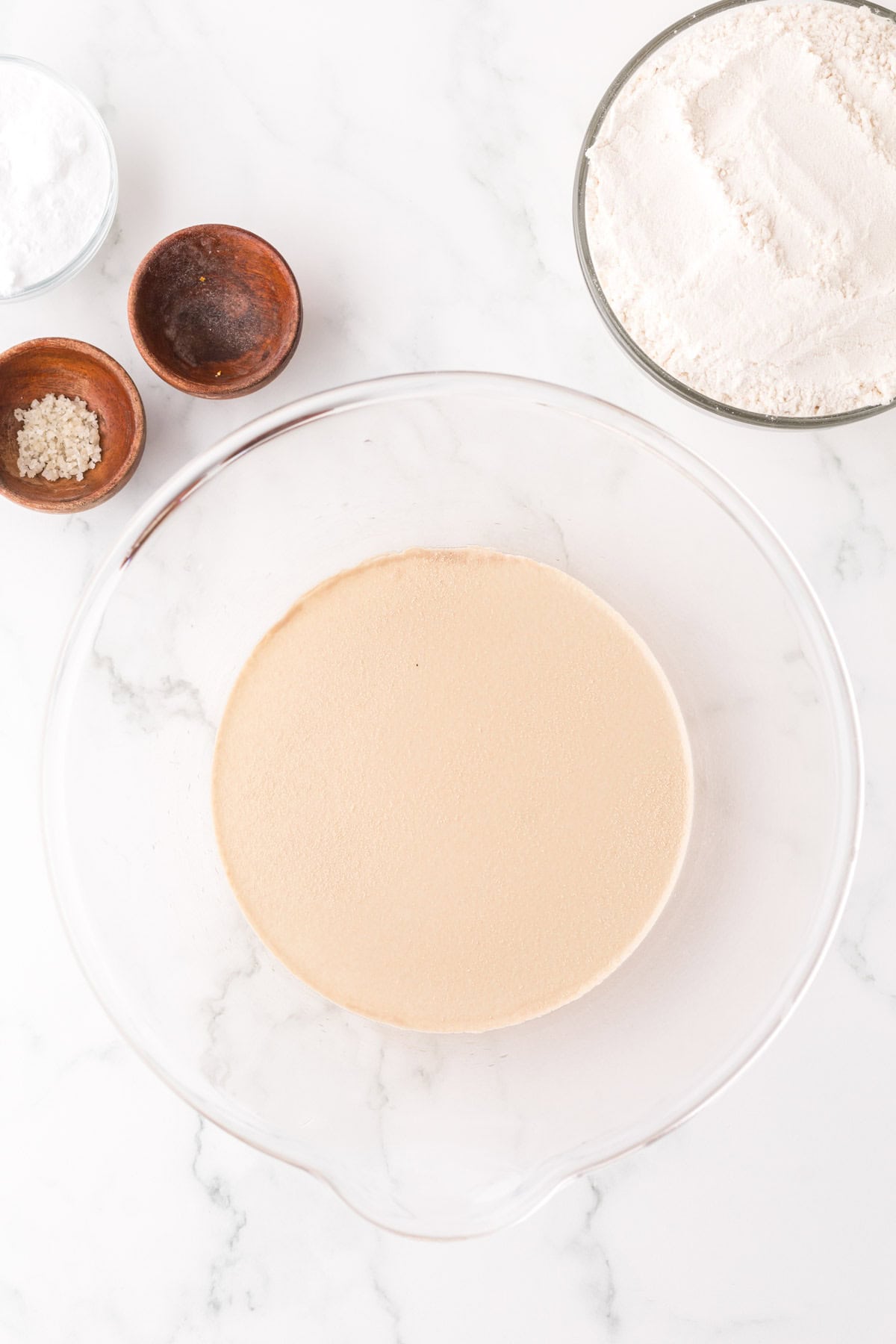 clear mixing bowl in the process of making big soft pretzels.